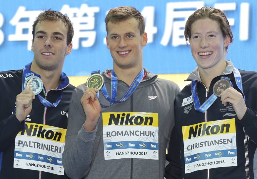 Il podio dei 1500 sl: da sinistra, Gregorio Paltrinieri, medaglia d&#39;argento, l&#39;ucraino Mykhailo Romanchuk, oro, e  Norvegese Henrik Christiansen, bronzo. Ap